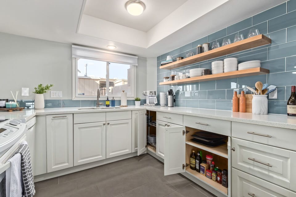 Fully stocked kitchen with stove, dishwasher, microwave, toaster, plates & more!