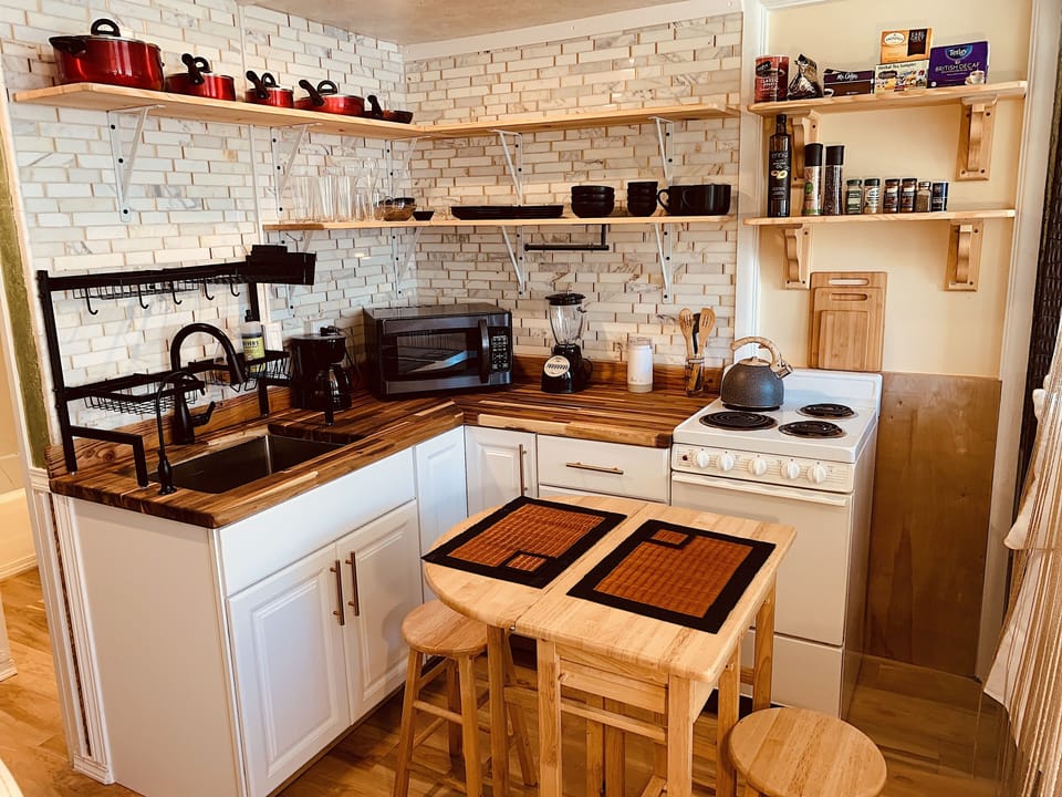 Kitchen with pull out dinning table and chairs.