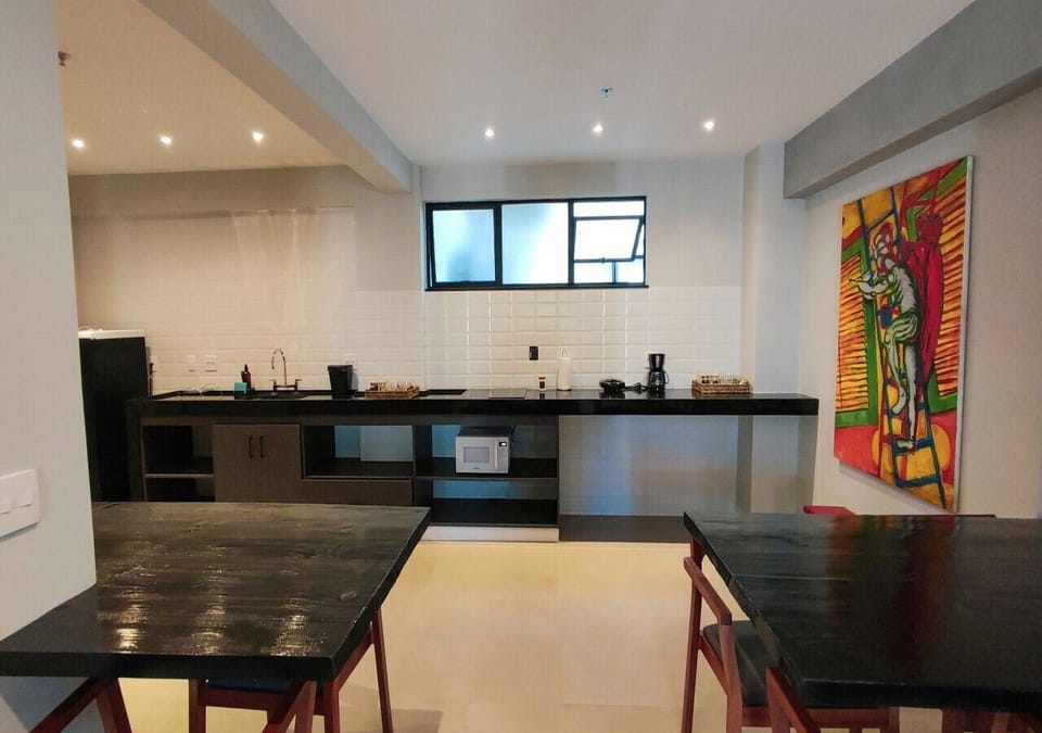Premium Studio Suite | Private kitchen | Fridge, microwave, stovetop, dining tables