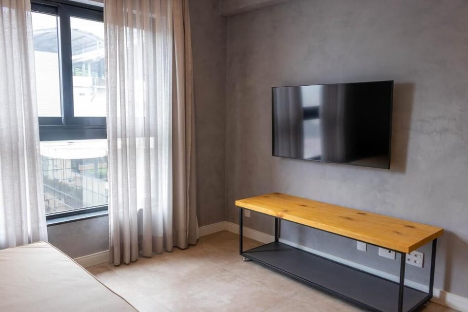 Presidential Studio Suite | Living area | 50-inch Smart TV with digital channels, TV