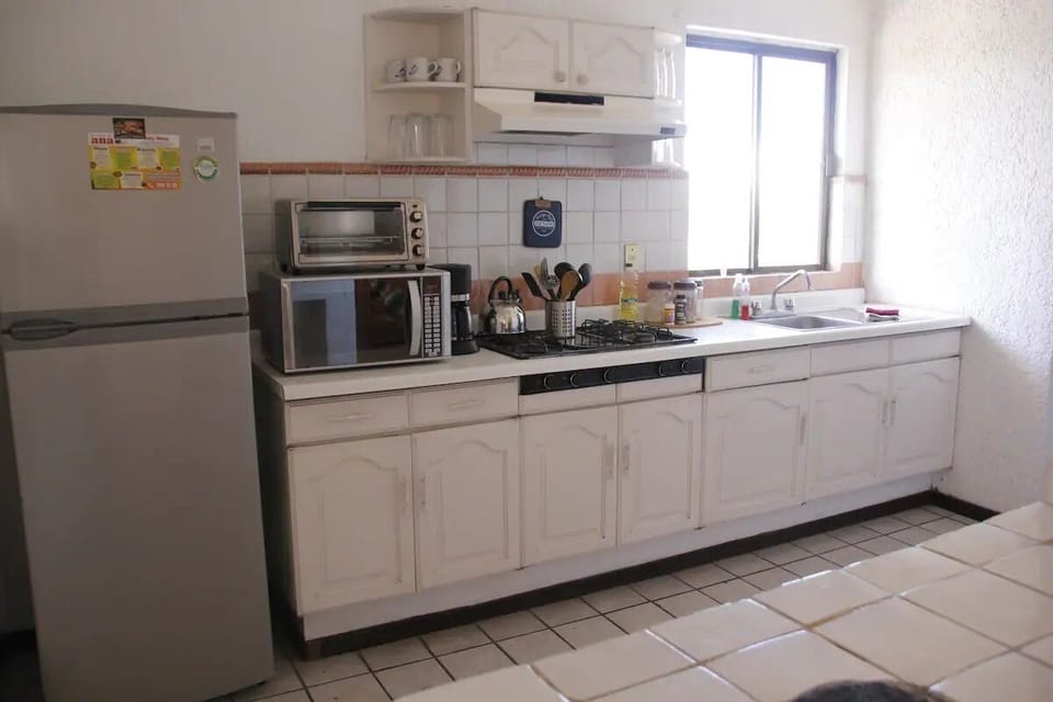 Economy Apartment | Private kitchen | Fridge