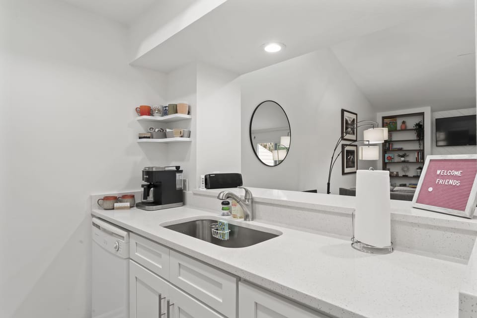 Kitchen overlooks dining/living areas