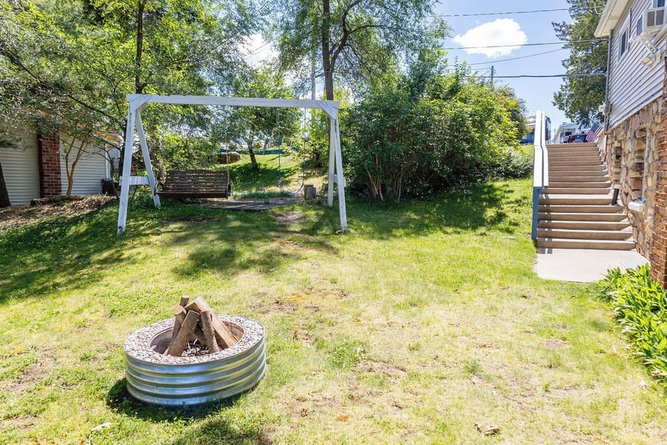 Side yard gathering space and fire pit some wood provided