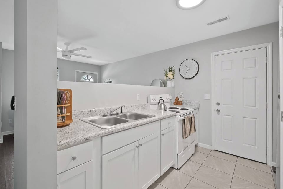 Take a look of our kitchen area, ready to be used for some home cooked meals! Our pots and pans can be found in the kitchen cabinets and there are some baking sheets in the storage drawer under the oven.