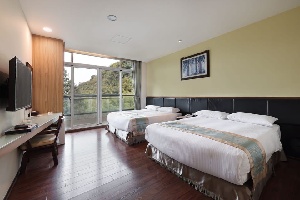 Quadruple Room | Down comforters, blackout drapes, free WiFi, bed sheets