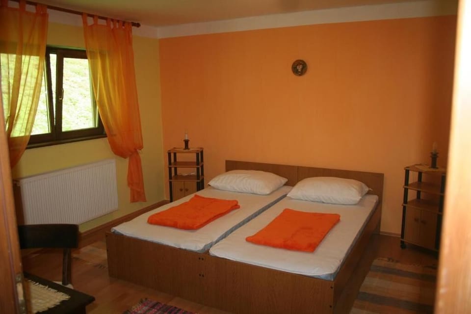 Desk, laptop workspace, iron/ironing board, bed sheets