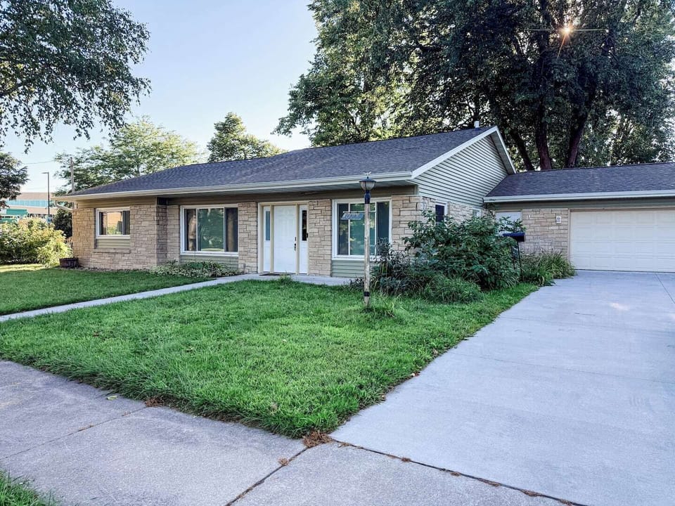 Large, double-wide driveway with ample parking for four vehicles. Street parking also available if needed.