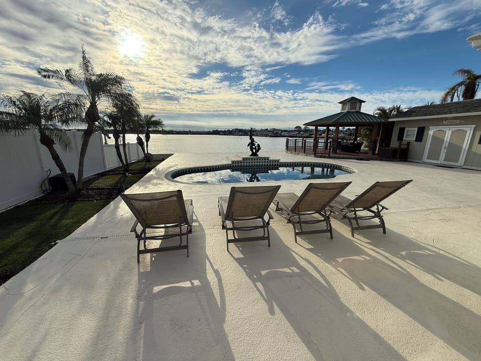 Watch the most amazing sunrises over the dolphins swimming in bayou by the fire!