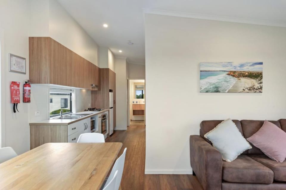 Deluxe 2 Bedroom Waterfront Cabin | Living area | LCD TV