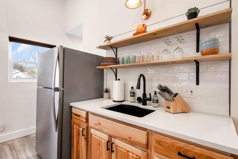 Kitchen with stainless steel appliances and Quartz Countertops