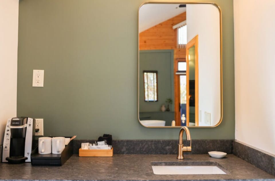 Stone Vanity with Gold Faucets