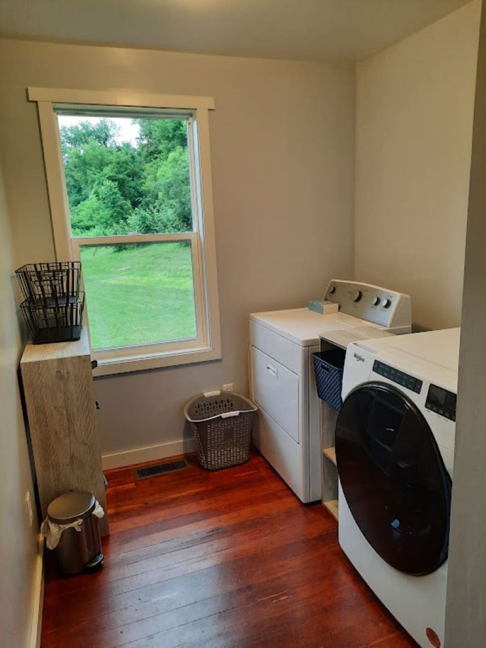 Laundry room with washer, dryer, iron and tabletop ironing board