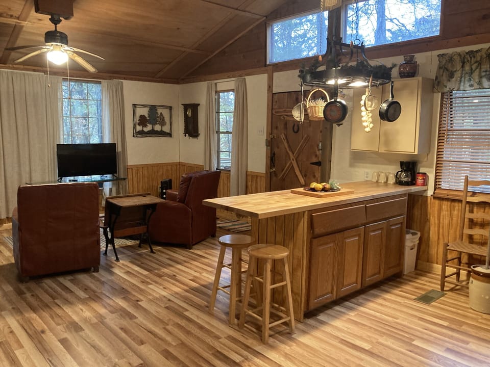 No inside dining table. 2 stools & 2 folding trays. Table w/chairs on porch.