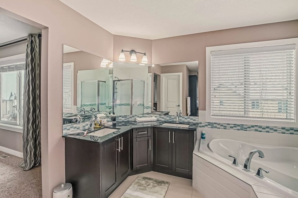 Master ensuite with tub, standing shower, double sink and make up vanity