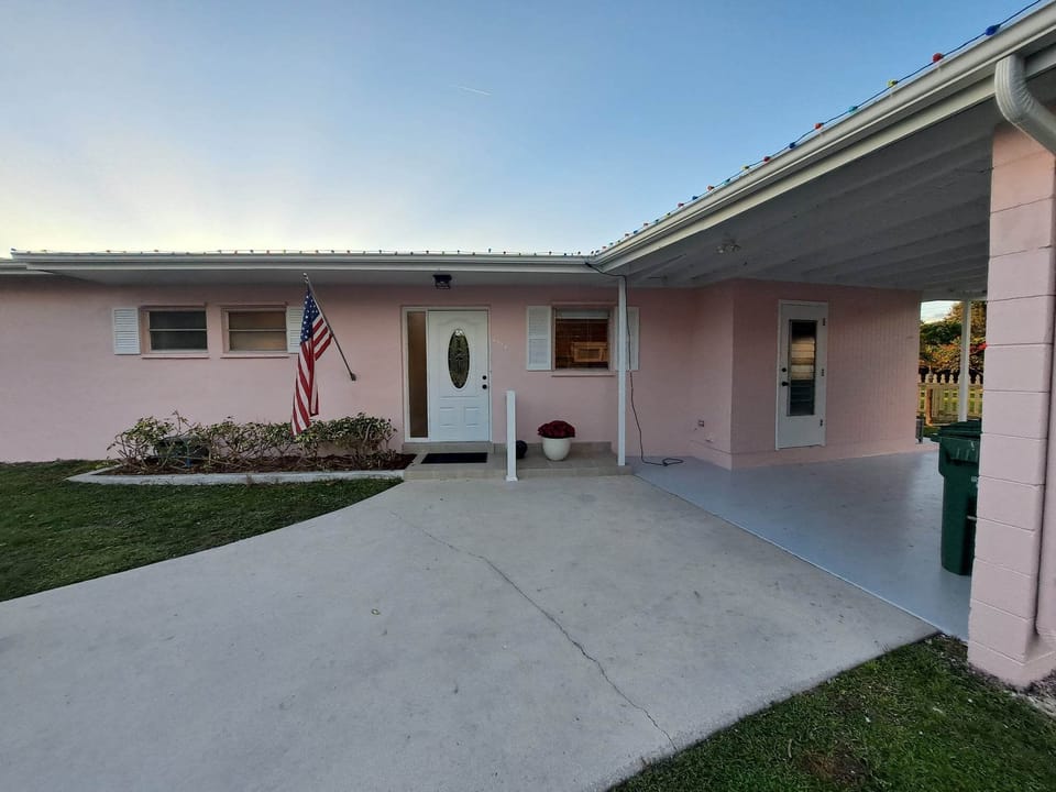 Front of house Large Driveway & Covered Carport
