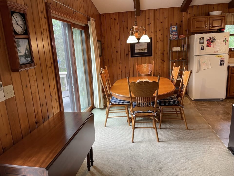 Drop-leaf table doubles as extra seating for dining and desk for workspace.
