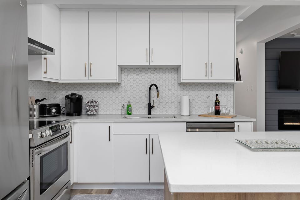 This modern beautiful kitchen is equipped to be your home away from home.