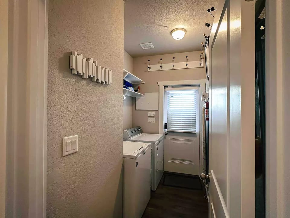 Full size washer and dryer. Door leads to side yard. 