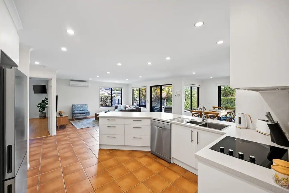 Open plan kitchen, dining and living areas.