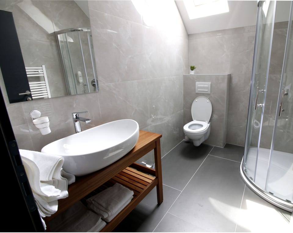 Shower, hair dryer, slippers, towels