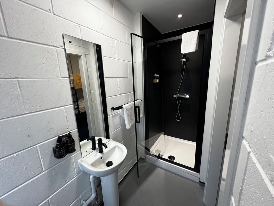 Family Room | Bathroom | Shower, designer toiletries, hair dryer, towels