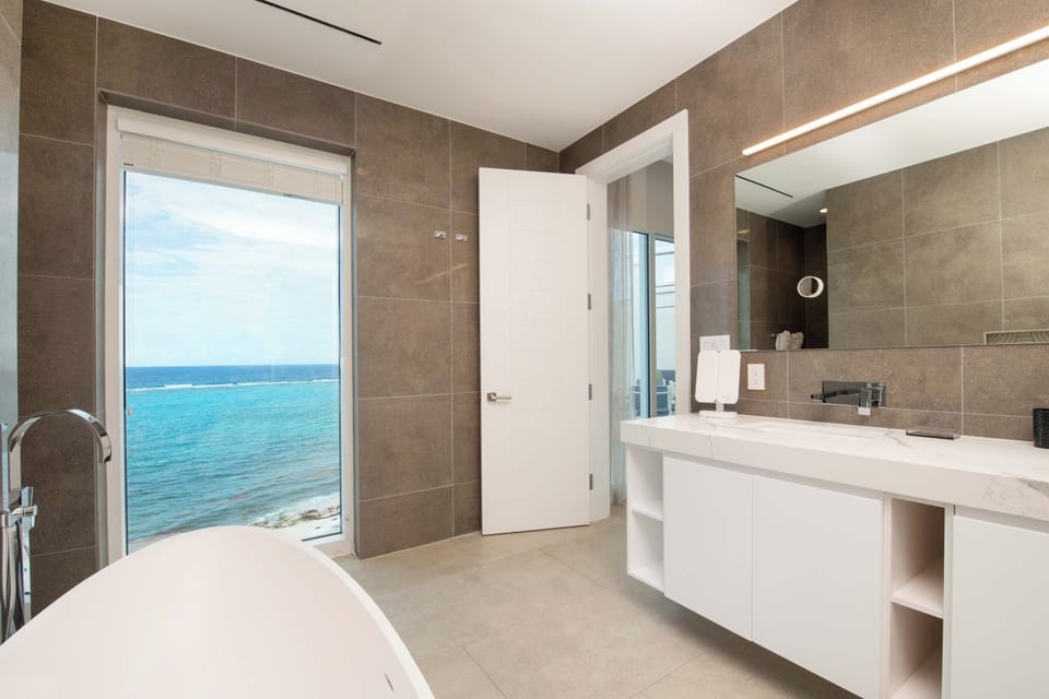 Primary Suite ensuite bath with dual vanity, soaking tub, and walk-in shower.