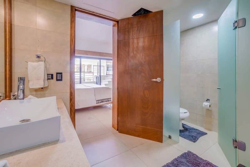 Freshen up in the sleek ensuite bathroom, complete with a modern vanity.