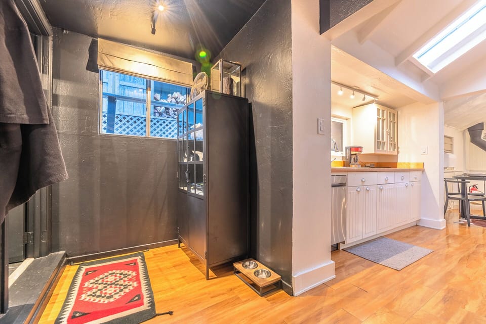 To the left is the bath and the kitchen on the right.