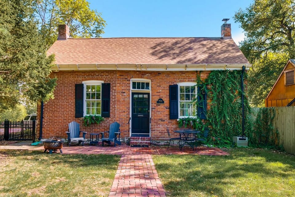 Enjoy the big front yard with Adirondack chairs and table seating for four.