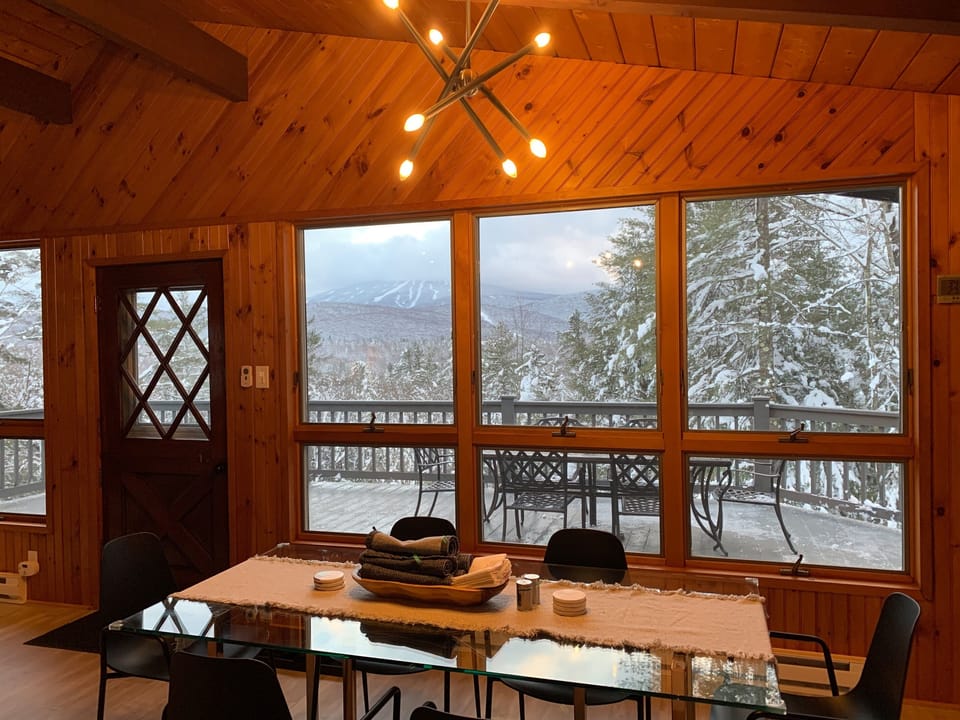 Enjoy the snow-covered trees from the lovely dining room.