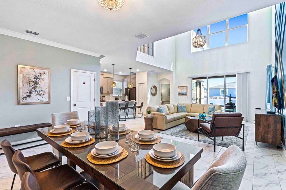Charming Townhouse in Davenport Florida - High Ceiling with large windows - Open layout seamlessly connecting the dining area to the kitchen or living room - Customized decor reflecting a sophisticated design sensibility