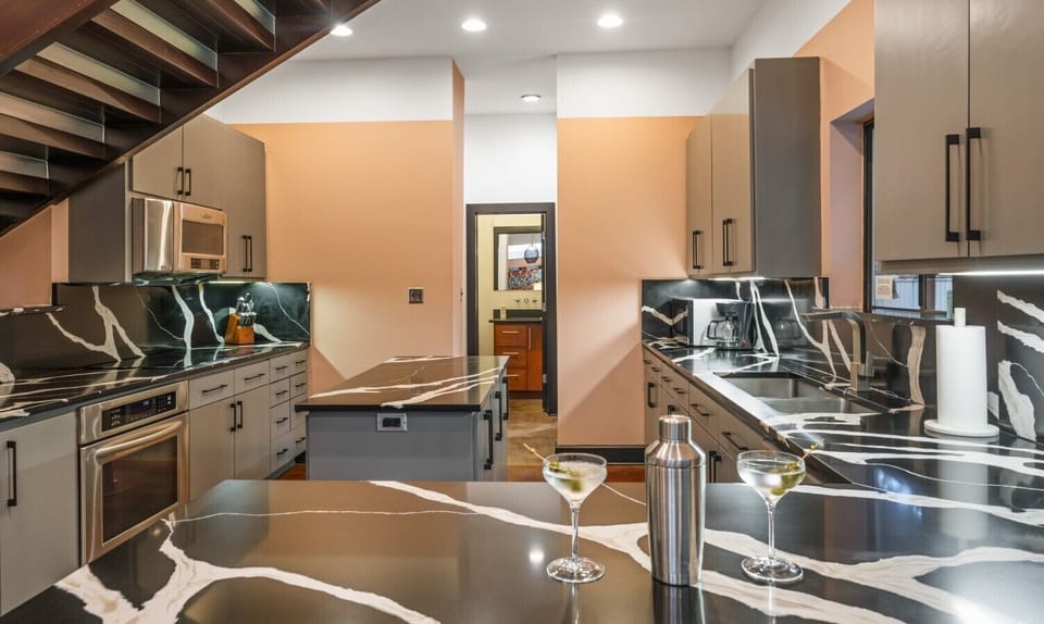 Spacious kitchen stocked with everything you need for dinner parties, happy hours, and cocktail making.