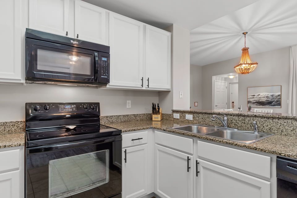 Plenty of room for the Chef of the family in this fully stocked Kitchen. 