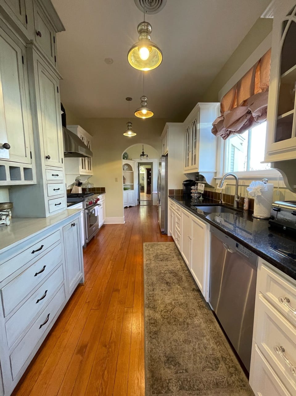 Kitchen is fully stocked with utensils and cooking items 