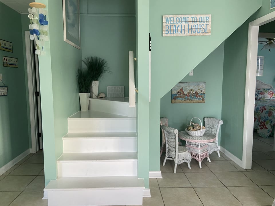 Stairs to Bedrooms 3 & 4 and half bath.