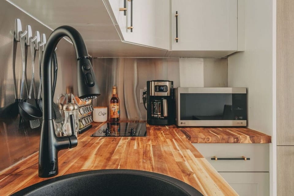 Stunning kitchen including a coffee maker and microwave.