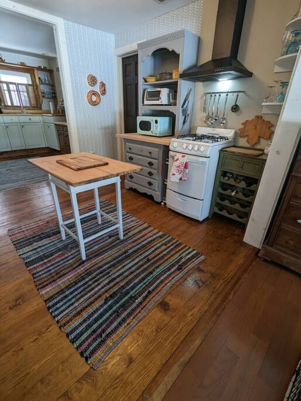 View from lounge into kitchen area/original cottage complete with sloped floors :)