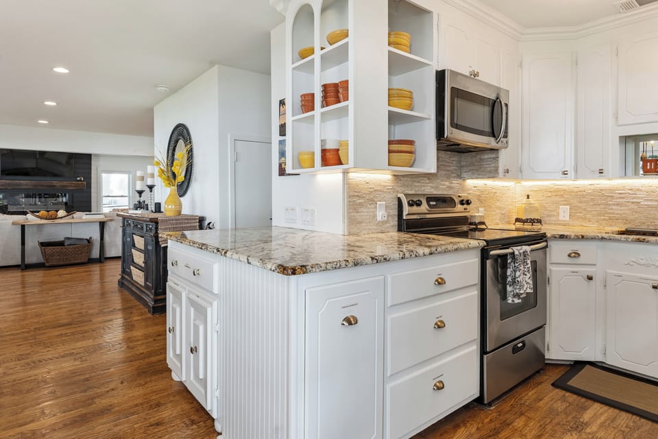 Large granite serving area makes for easy food prep and buffet area.