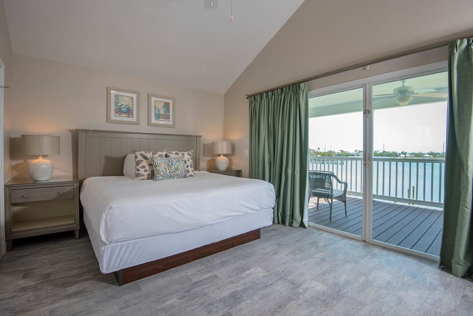 The master bedroom features a king bed. Additional bedrooms offer 1–2 beds and vary by unit.