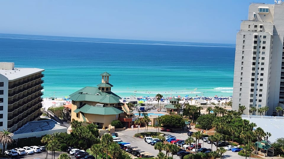 View of path to closest beach entrance past the parking lot, beach side restaurants
