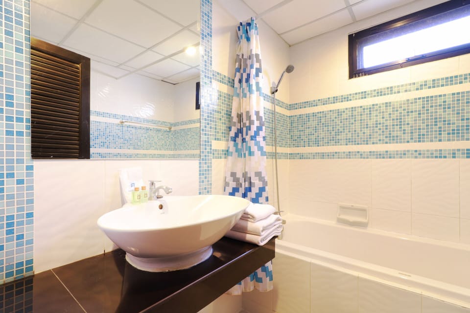 Suite, 2 Bedrooms | Bathroom | Shower, towels, soap, shampoo