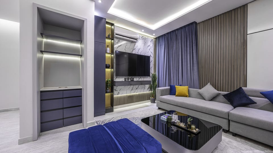 Apartment, 2 Bedrooms | Living area | 70-inch TV with digital channels
