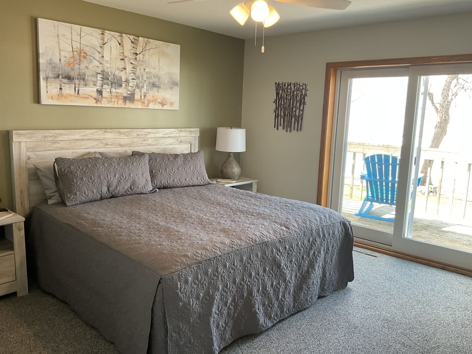 Master bedroom with king size bed and beautiful view