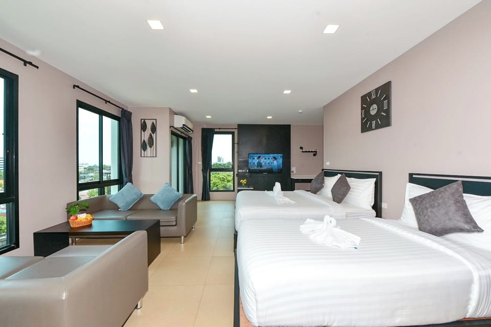 Family Room | Premium bedding, down comforters, desk, laptop workspace