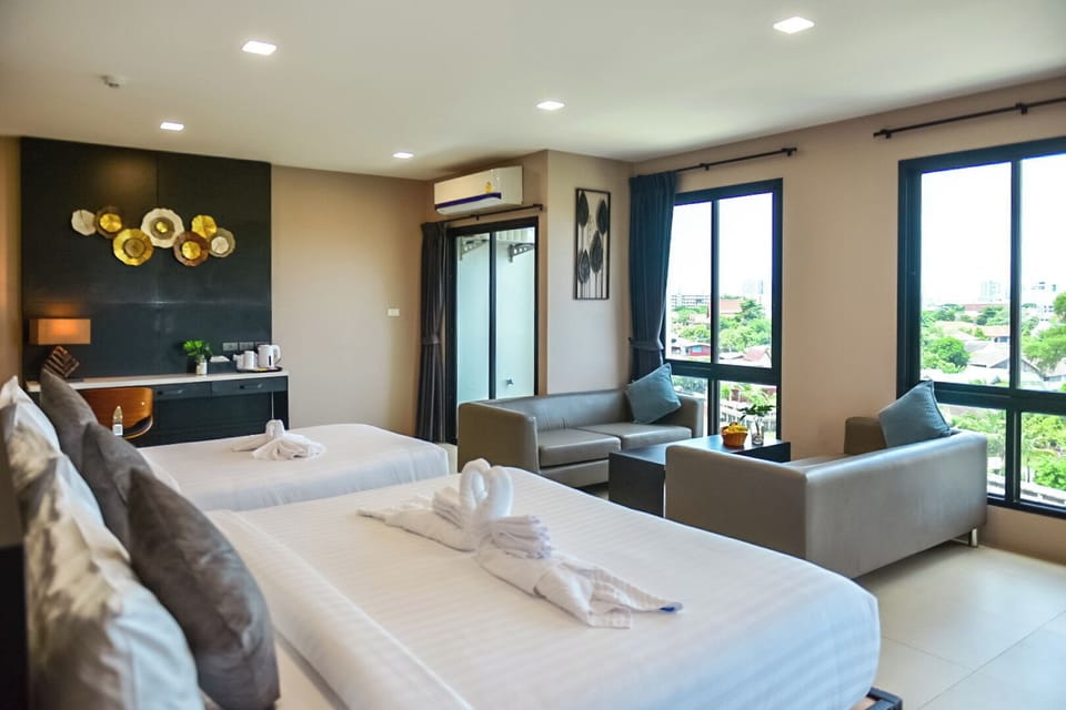 Family Room | Premium bedding, down comforters, desk, laptop workspace