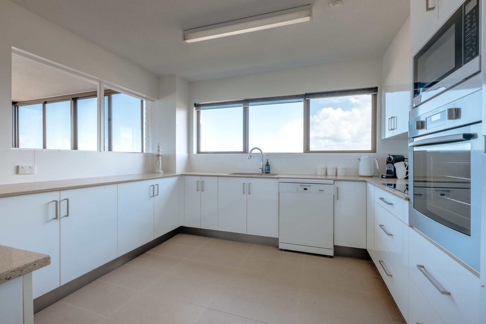 Fully equipped, the kitchen features plenty of utensils and appliances.