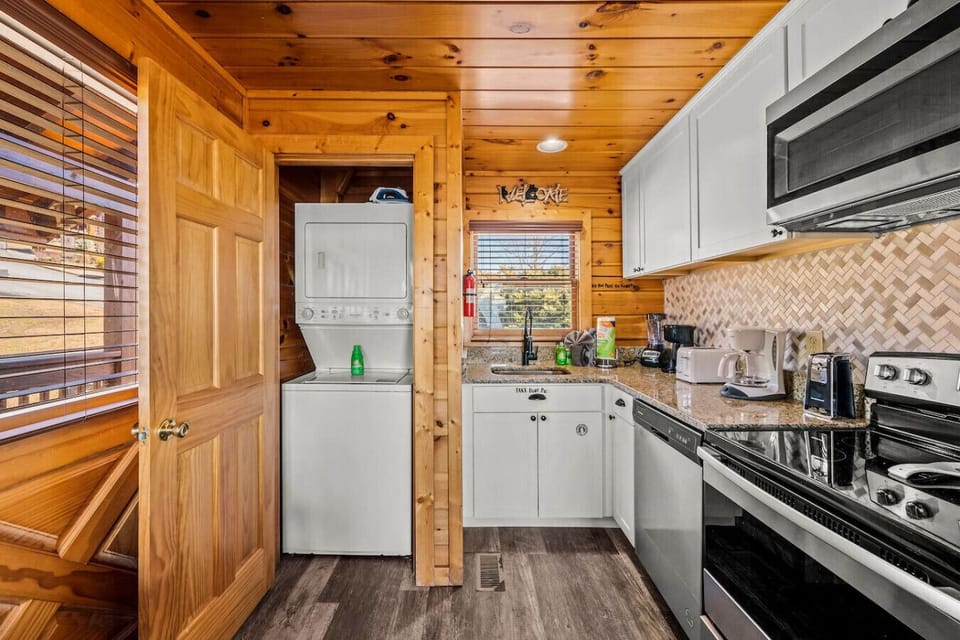 There is a washer-dryer located in the closet just behind the front door.
