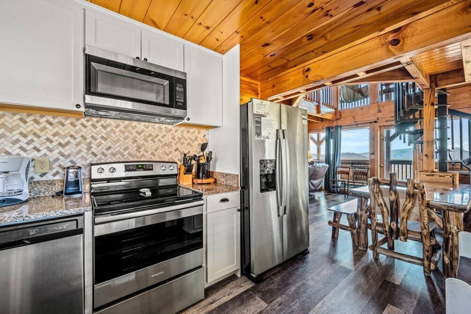 Enter the cabin through the fully-equipped kitchen that is a suite of stainless steel appliances.