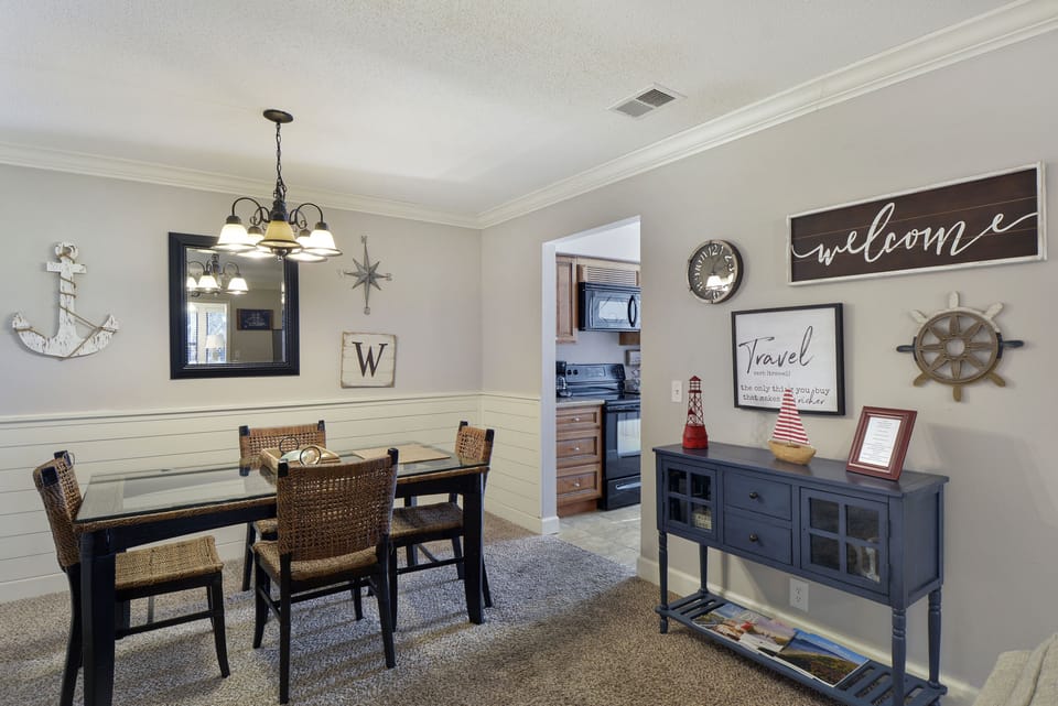 Dining Area by Kitchen and Living Room - Dining table for four beside the living room, near the kitchen and second-floor entry.