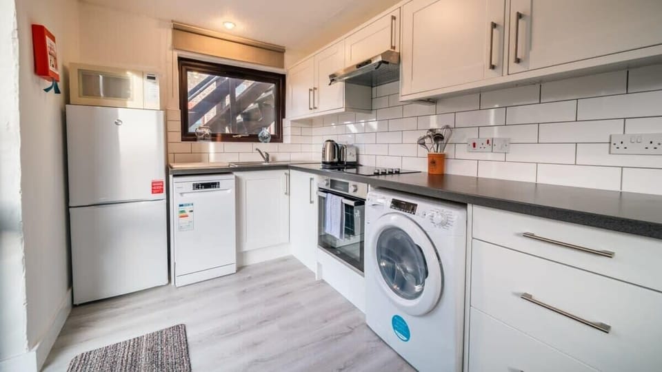 A fully equipped modern kitchen featuring a dishwasher and washer/dryer, so you can spend less time on chores and more time exploring.